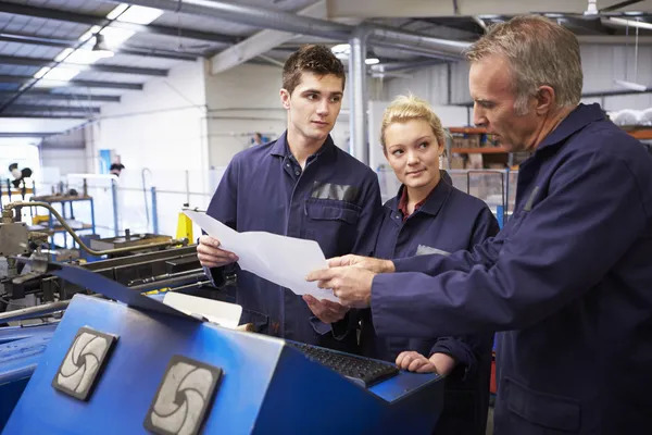 Depositphotos 48302389 stock photo engineer teaching apprentices